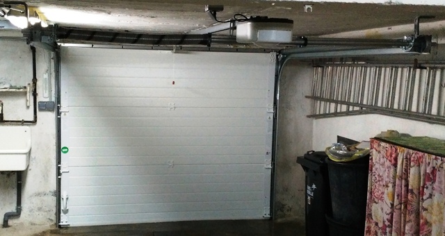 Double ressort pour porte de garage sectionnelle